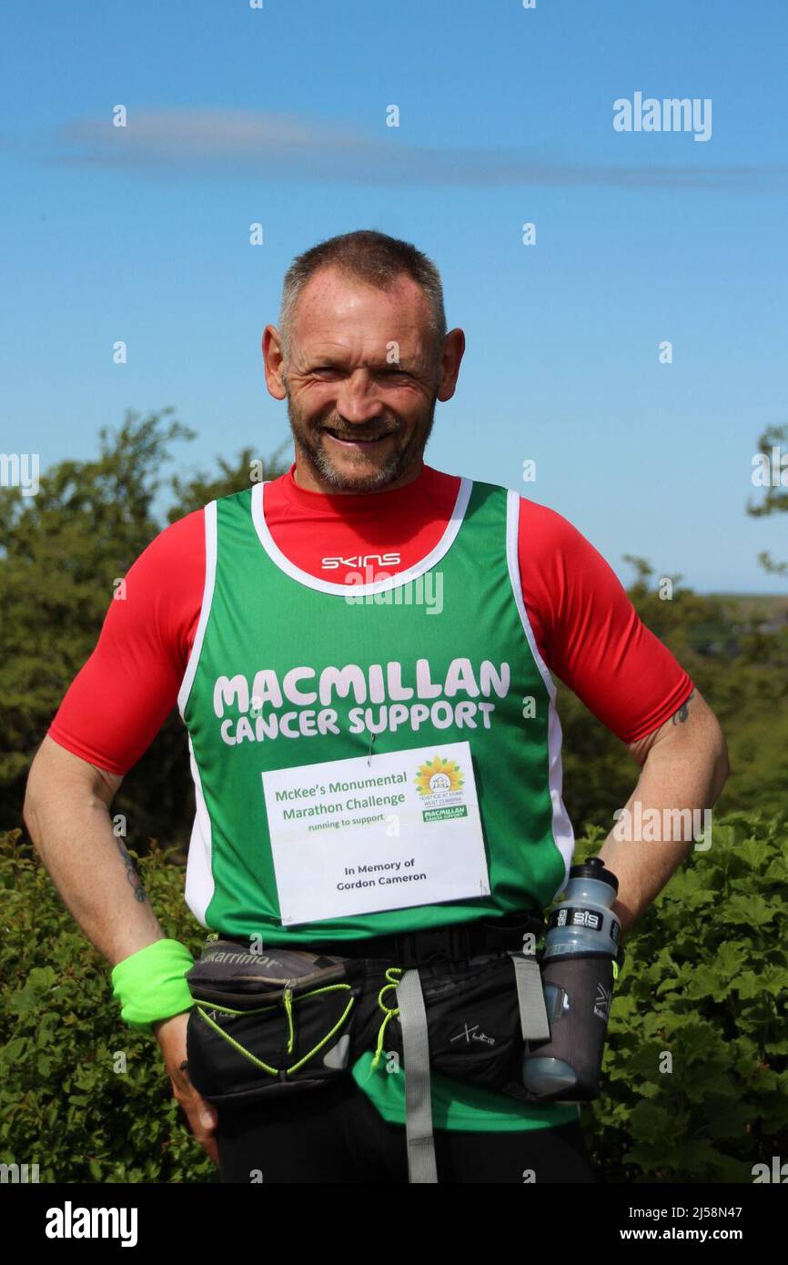 Undated handout photo of fundraiser Gary McKee who is attempting to run a marathon every day for a year has beaten his personal record by completing day 111 of his challenge. McKee has covered more than 2,900 miles since January 1, when he began running 26.2 miles a day to raise funds for Macmillan Cancer Support and Hospice At Home West Cumbria. Issue date: Thursday April 21, 2022. Stock Photo