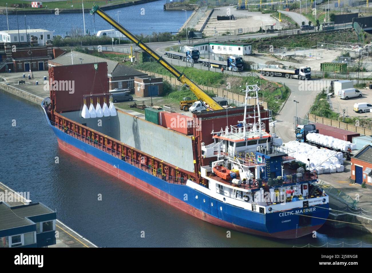Aerial view of Cargo Ship CELTIC MARINER alongside in the KGV Lock in London's Royal Docks ready to unload a cargo of cement powder from Portugal Stock Photo