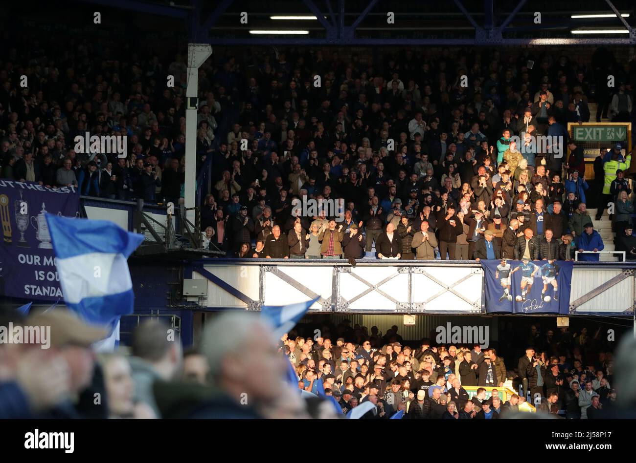 20th April 2022, Goodison Park, Liverpool, England; Premier League football, Everton versus Leicester; Everton supporters in the upper Bullens Road in the evening sunlight Stock Photo