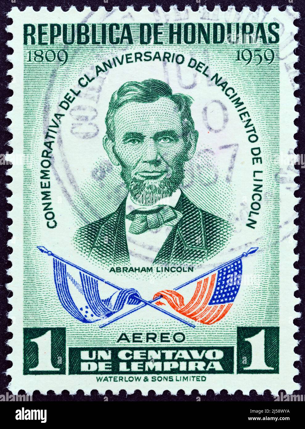 HONDURAS - CIRCA 1959: A stamp printed in Honduras from the '150th Anniversary of the Birth of Abraham Lincoln' issue shows Abraham Lincoln and flags. Stock Photo