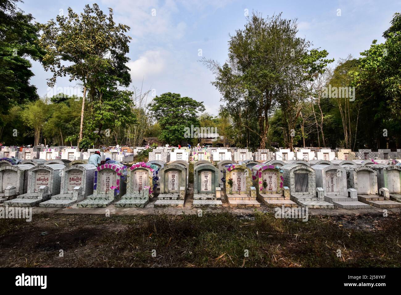 Pathein, Myanmar - April 3rd 2022: Groups of tombstones in Qingming Day. Remembering to chinese ancestors. Stock Photo