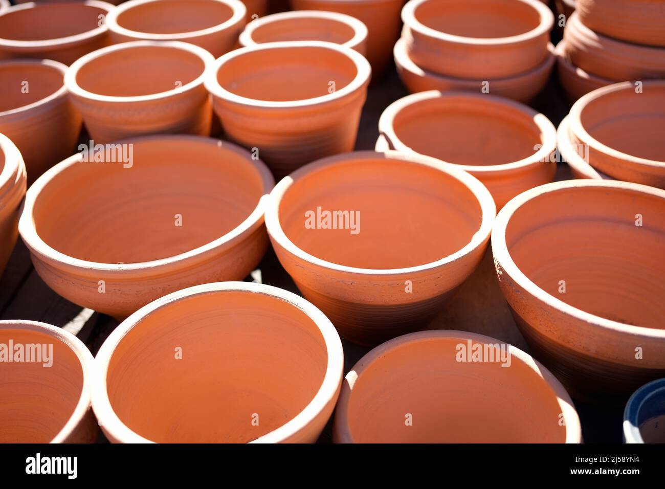 Lot of clay pots for sale on street background closeup Stock Photo Alamy