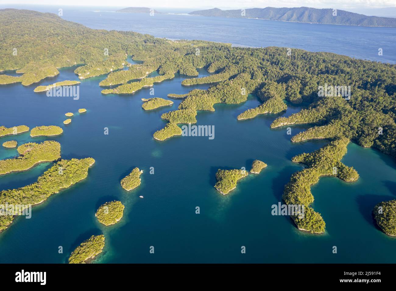 Aerial view of Gam Island calcium carbonate coastal structures, Raja Ampat Indonesia. Stock Photo