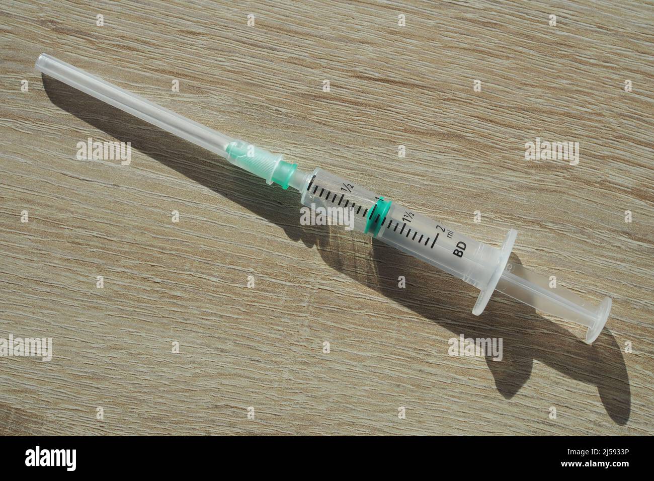 Sterile medical syringe with needle and protective cover Stock Photo