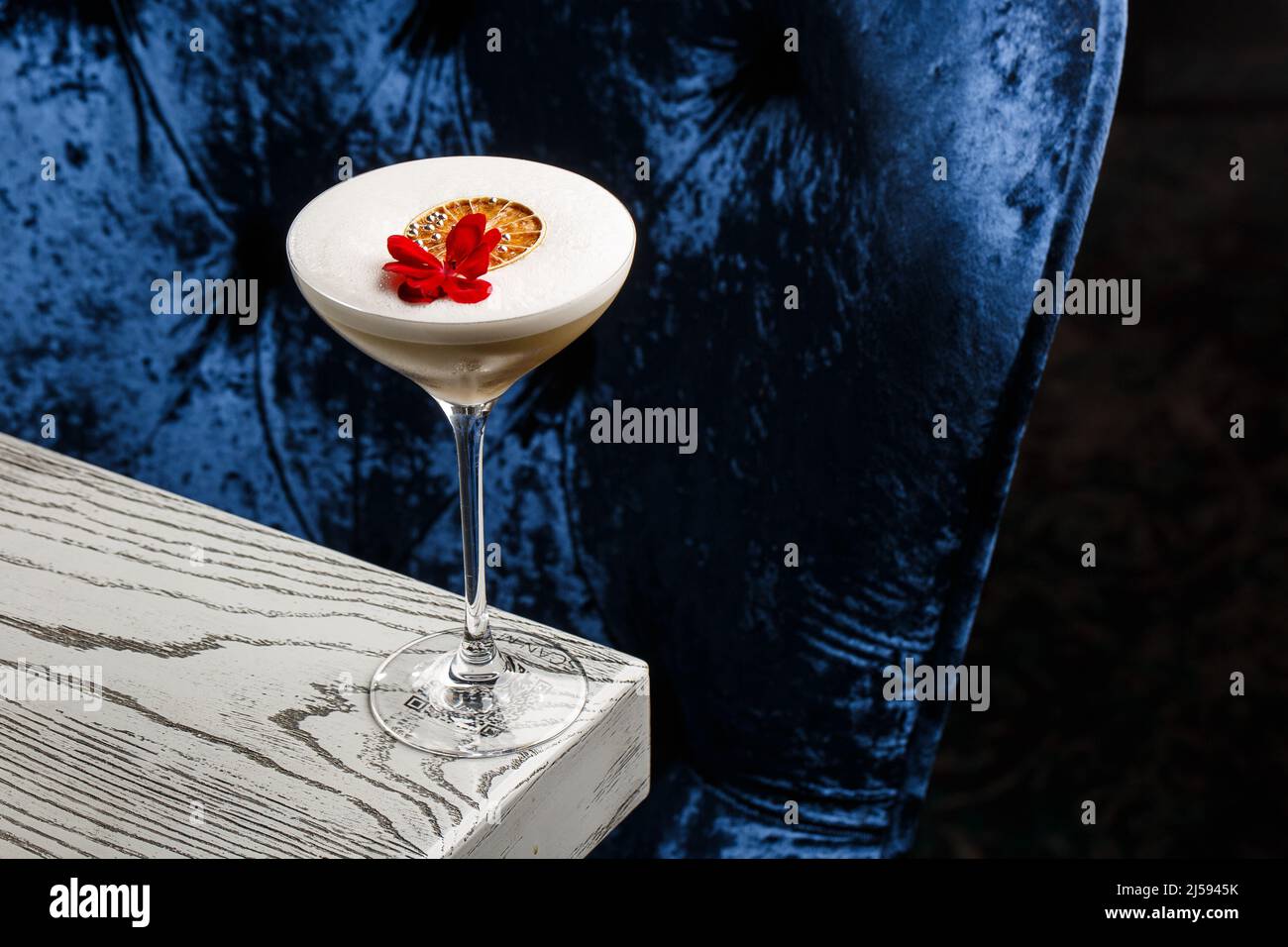 Coffee cocktails and liquor on blue reflective background. Copy space