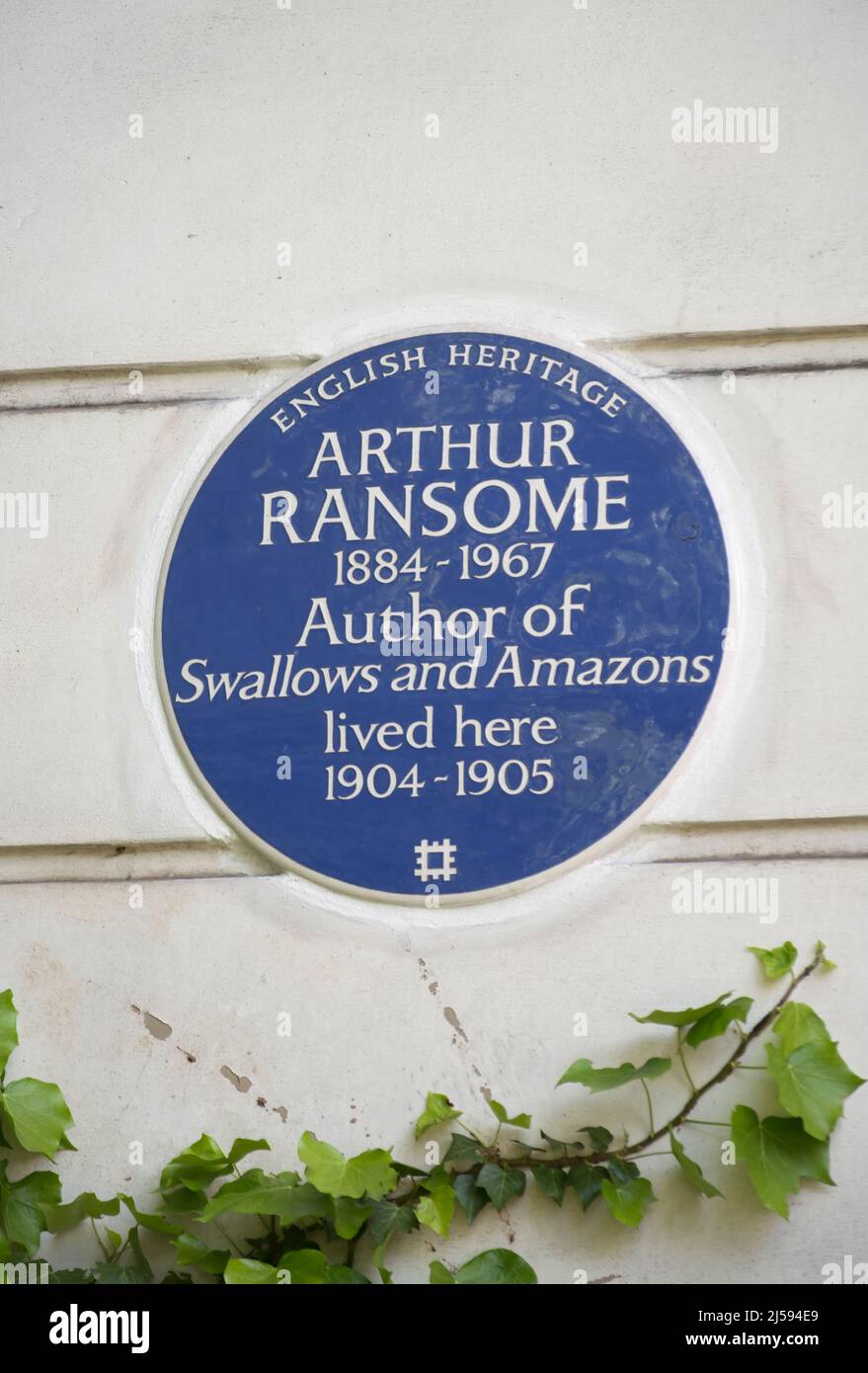 english heritage blue plaque marking a home of writer arthur ransome, author of swallows and amazons, london, england Stock Photo