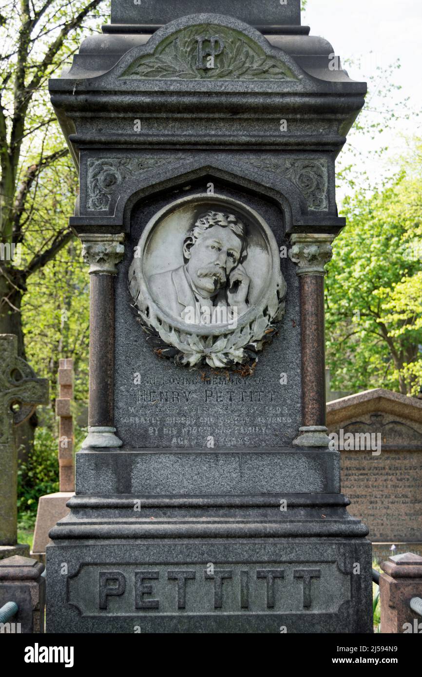 memorial with portrait marking the grave of 19th-century playwright, henry pettitt, brompton cemetery, london, england Stock Photo