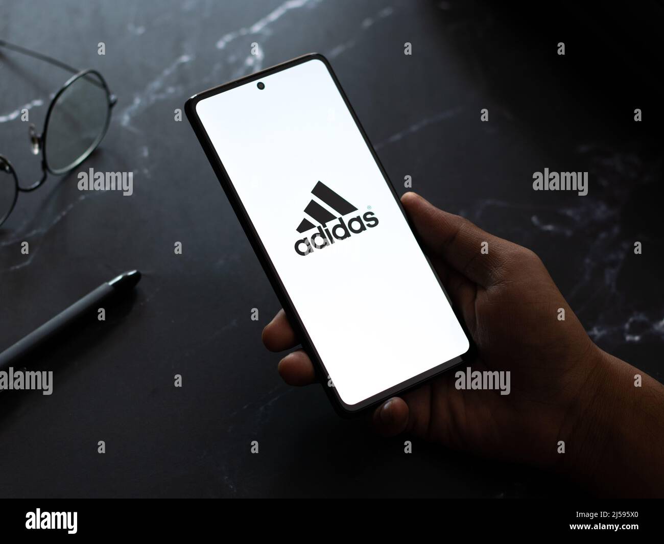 West Bangal, India - April 20, 2022 : Adidas logo on phone screen stock  image Stock Photo - Alamy