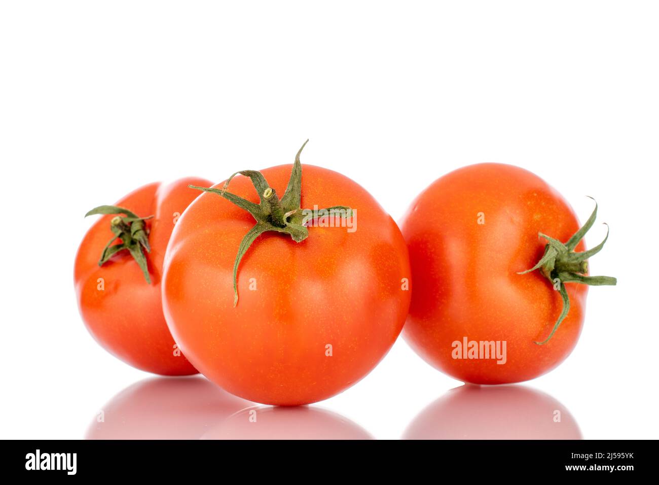 Three red ripe tomatoes, macro, isolated on a white background Stock ...