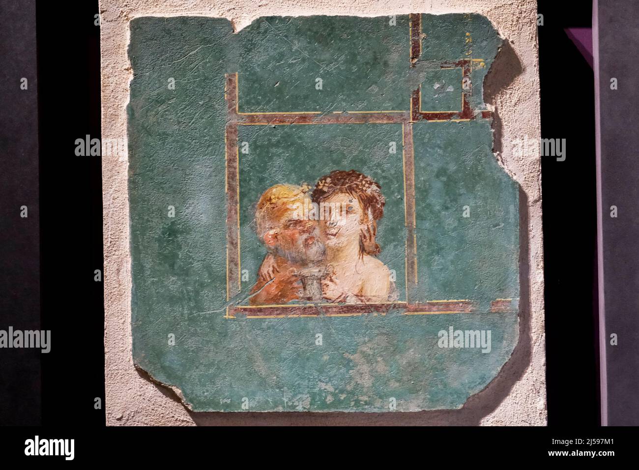 Maenad embraces an old Chilean and offers a silver cup for the wine displayed at the exhibition 'Art and sensuality in the houses of Pompeii' 70 works on display, all from the storerooms of the Archaeological Park of Pompeii, Inaugurated today 21 April 2022 inside the large gymnasium Stock Photo