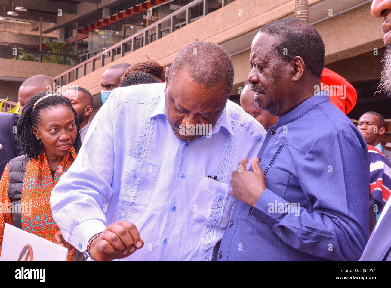 President Uhuru Kenyatta (left) speaks with the Presidential Candidate for Azimio la Umoja -One Kenya coalition, Raila Odinga at KICC after the coalition’s council held a meeting where an Advisory Panel was appointed to recommend a suitable candidate for the nomination of Deputy President. Stock Photo