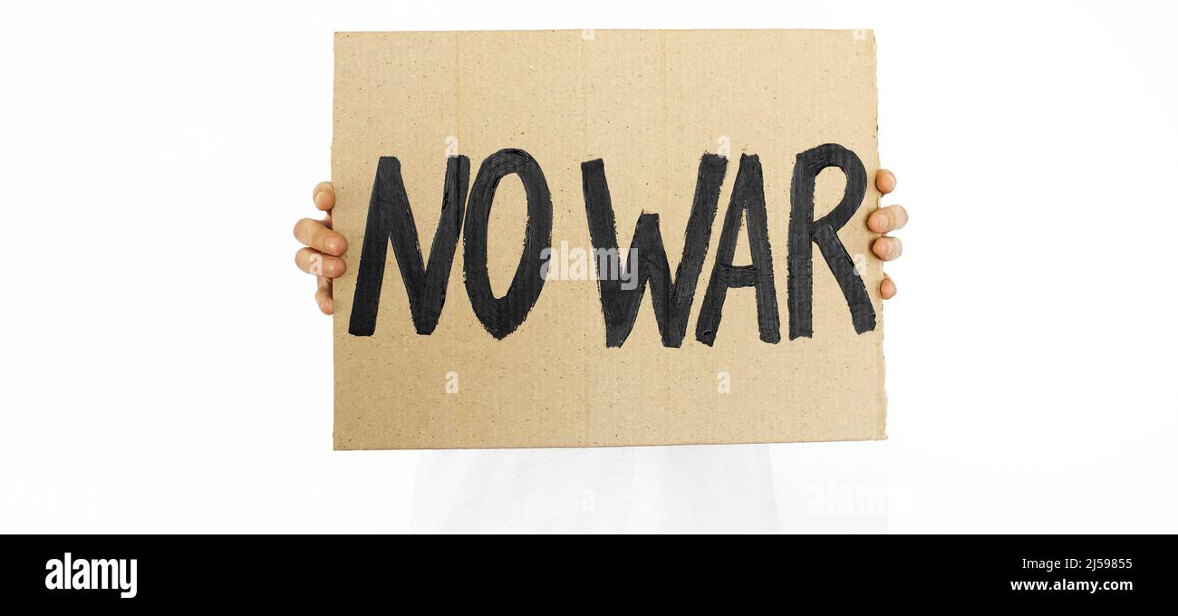 Russia's war against Ukraine. The guy with the message to stop the war. Text plate 'NO WAR'. Stock Photo