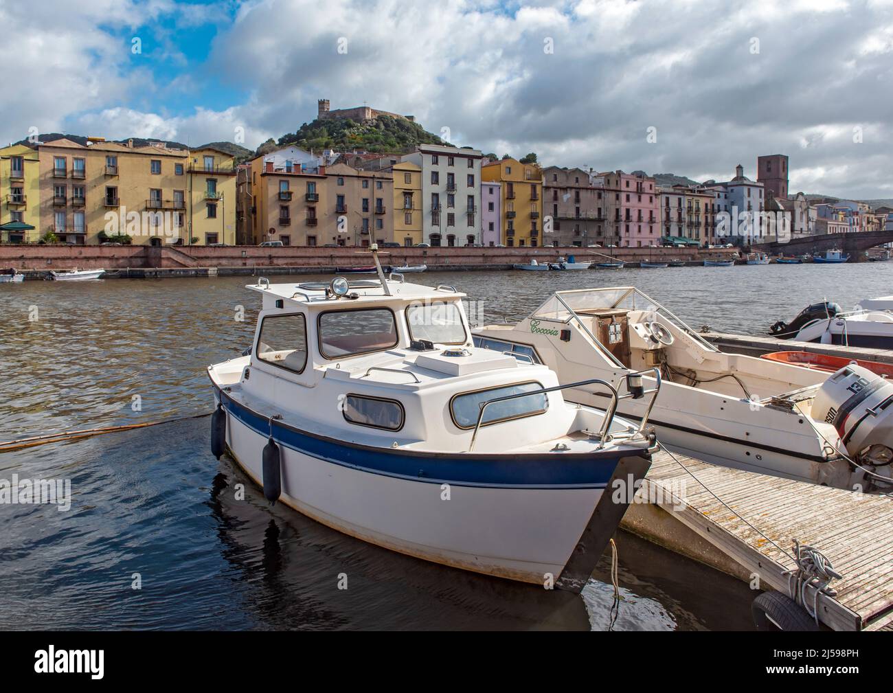 Boats on Temo River and Castle of Serravalle, Bosa, Sardinia, Italy Stock Photo