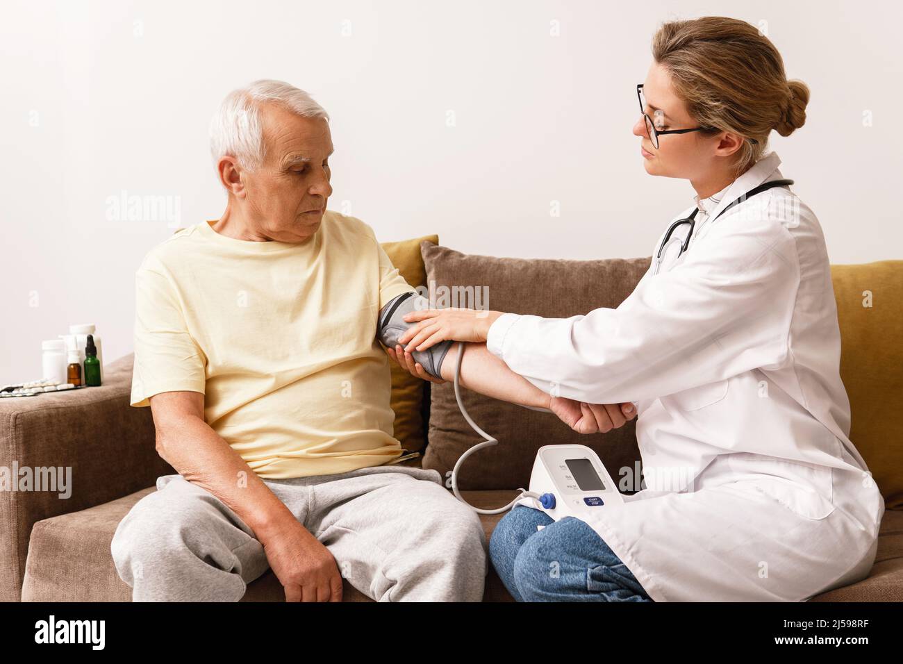 Visit man blood pressure measurement hi-res stock photography and ...