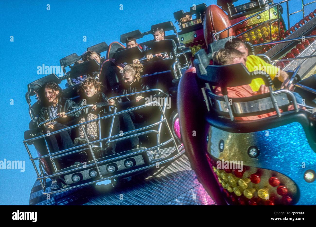 Young girls enjoying a fairground ride on King's Lynn Mart Stock Photo ...