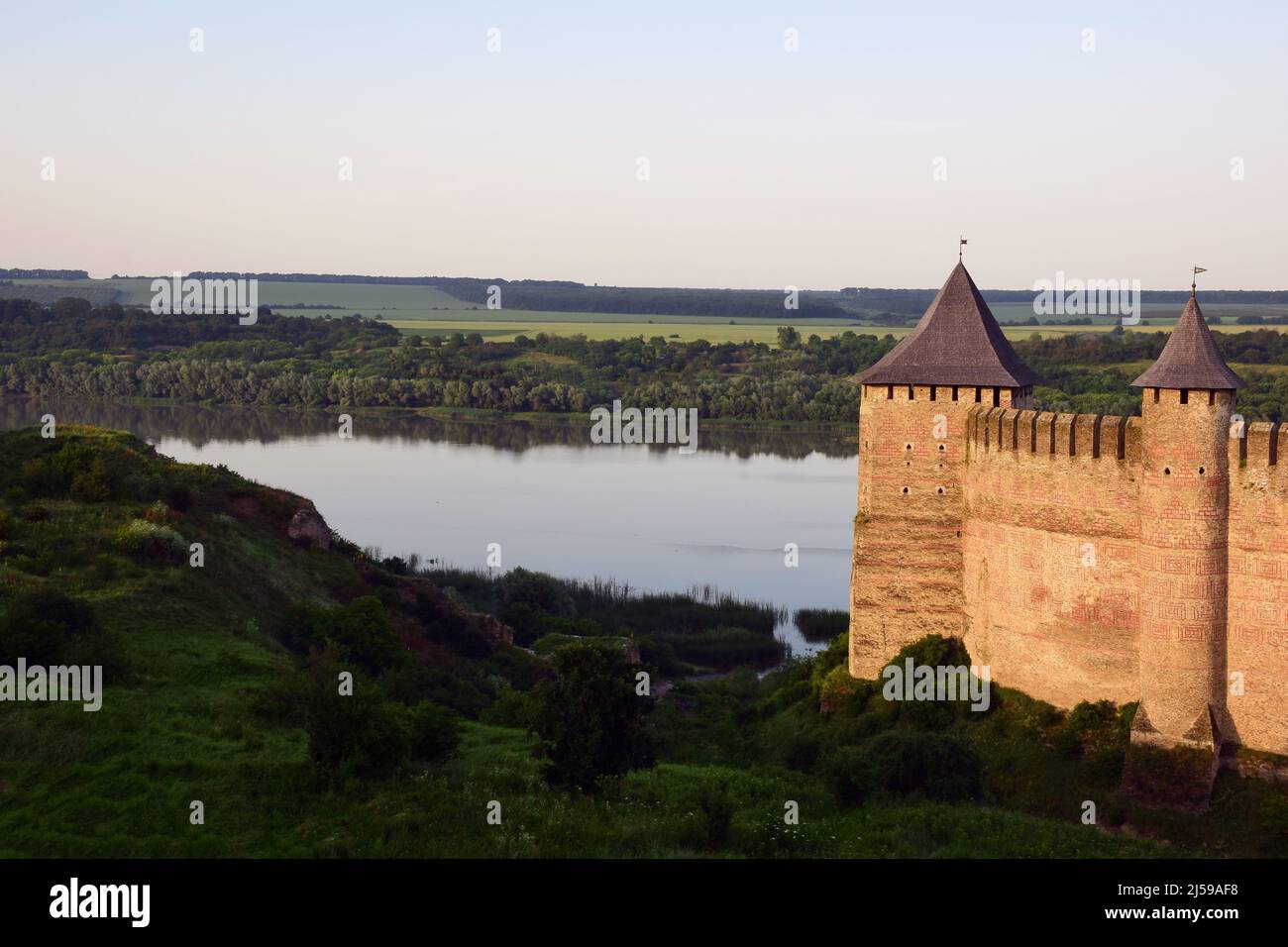 On the right side of the tower of a medieval stone fortress with ...