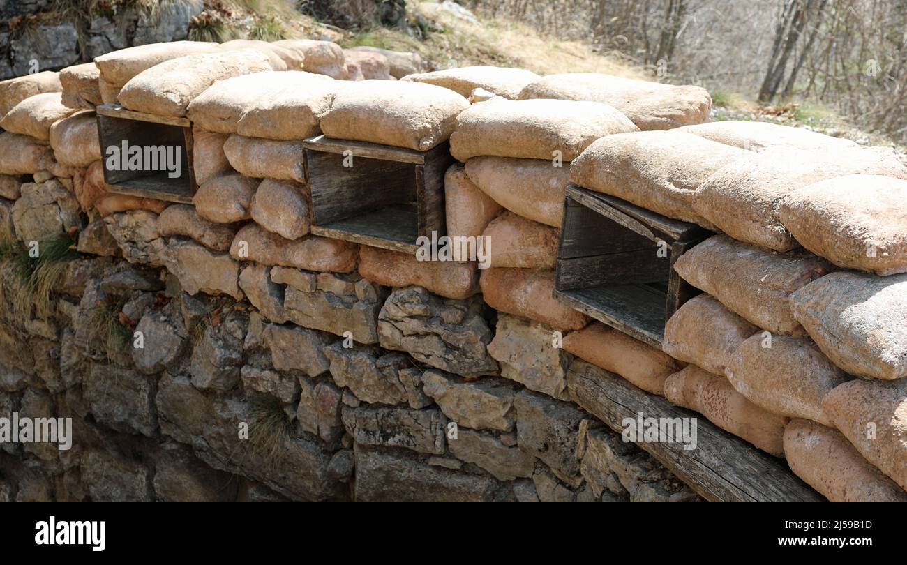 piles of many sandbags installed by army soldiers to defend against enemy attacks during war Stock Photo