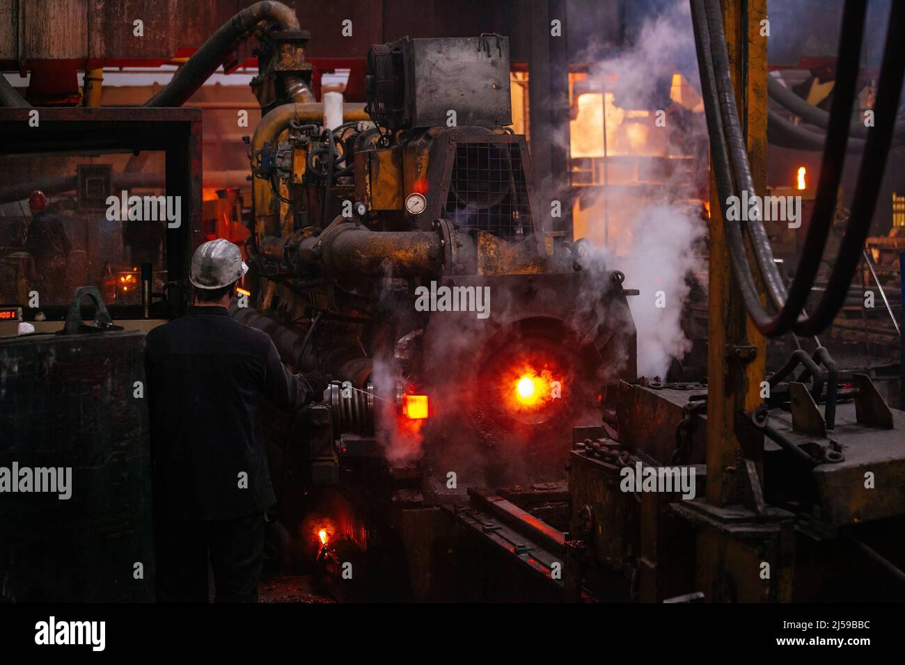 Iron pipe centrifugal pipe casting machine at the foundry. Stock Photo
