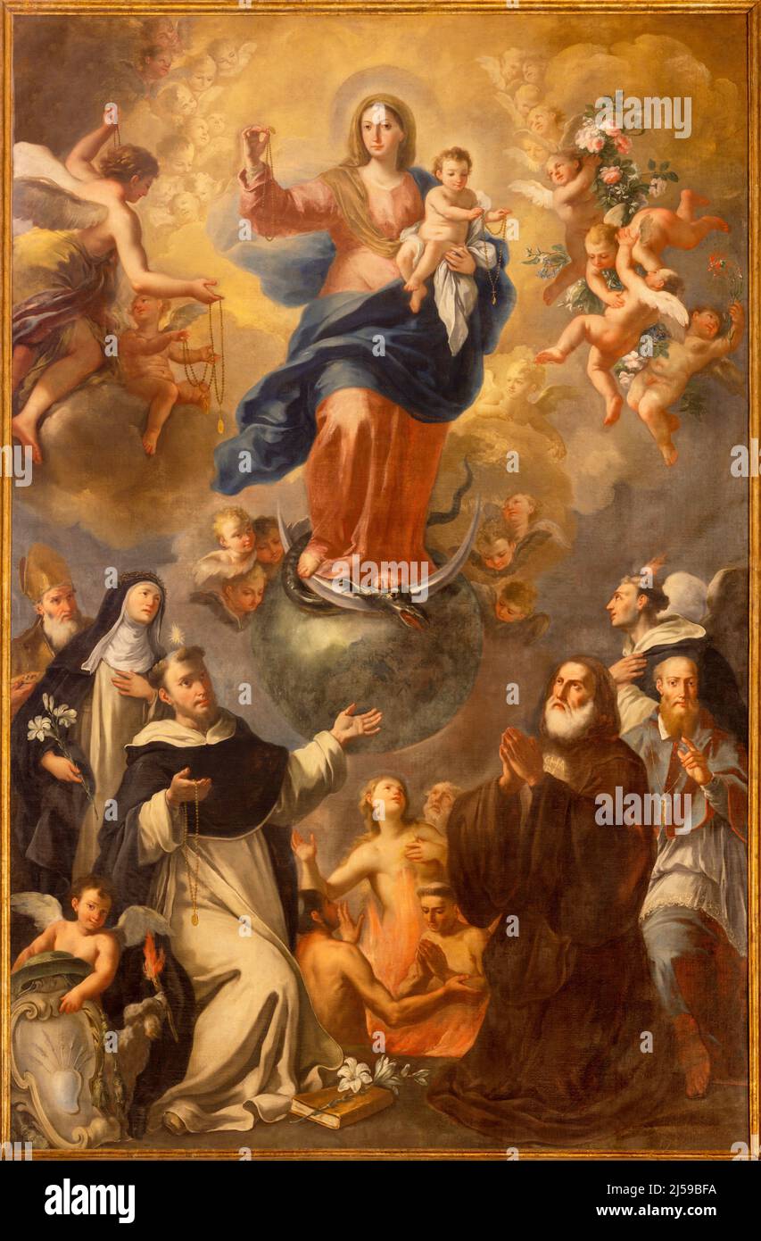 MONOPOLI, ITALY - MARCH 5, 2022: The baroque painting of Madonna of rosary among the saints in Cathedral - Basilica di Maria Santissima della Madia Stock Photo