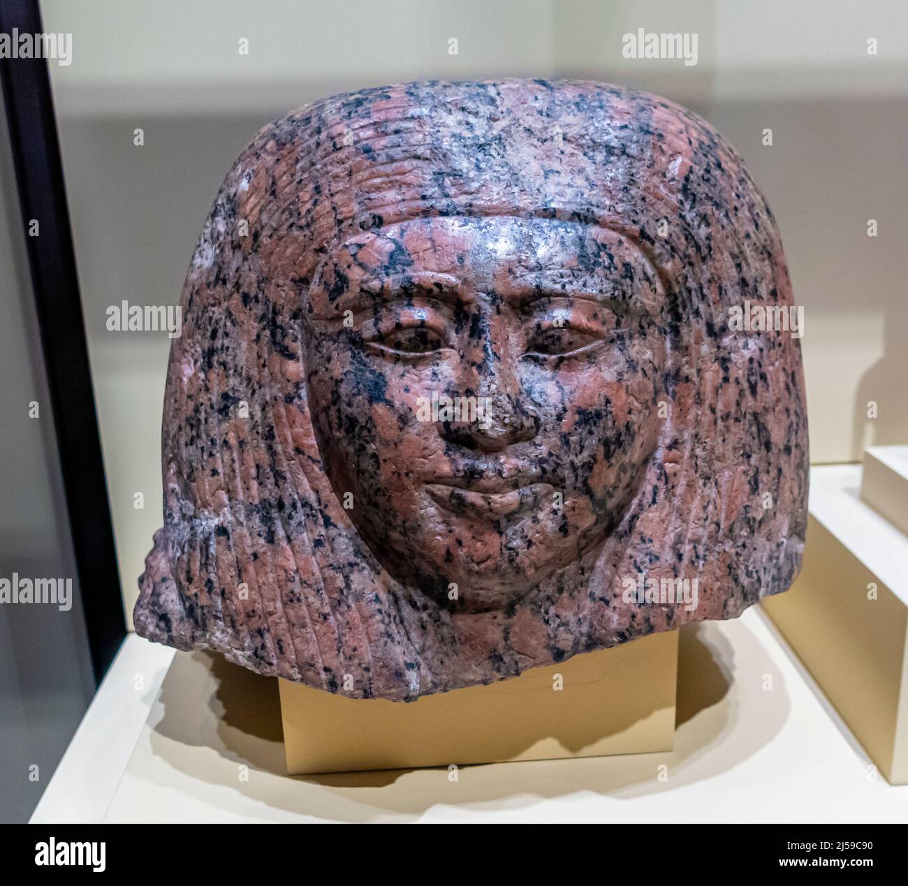 Ancient Egypt art - Head of a Lady - Pink granite - New Kingdom - 19th dynasty - 1292 -1191 BC. National Archaeological Museum, Madrid. Spain Stock Photo