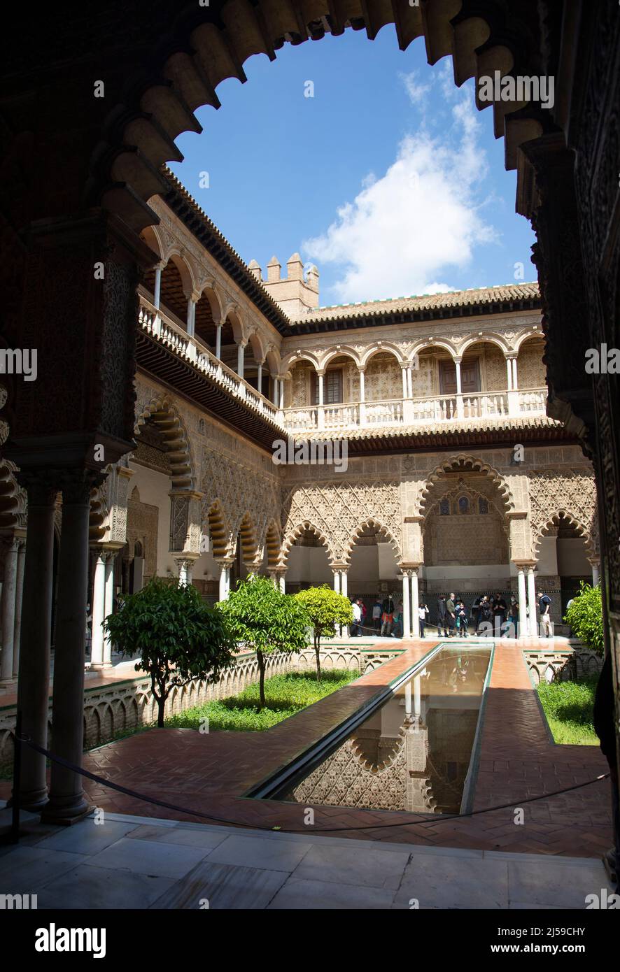 Pictured is Patio de las Doncellas in the Royal Alcázars of Seville, is a royal palace in Seville, Spain Stock Photo