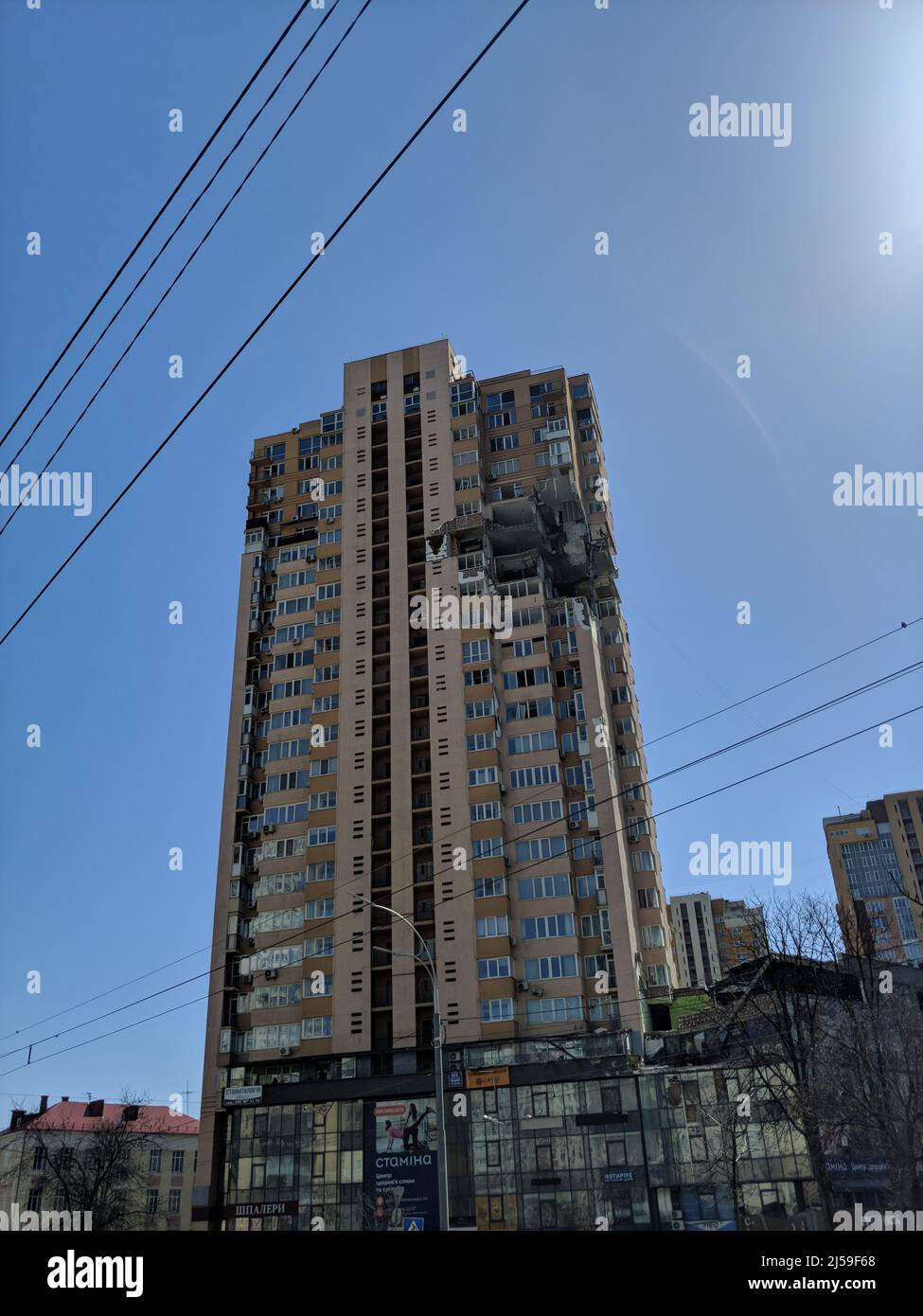 KYIV, UKRAINE - APRIL 15, 2022: Close-up of skyscraper was hit by russian rocket cruise guided missile in Ukrainian capital city  Stock Photo