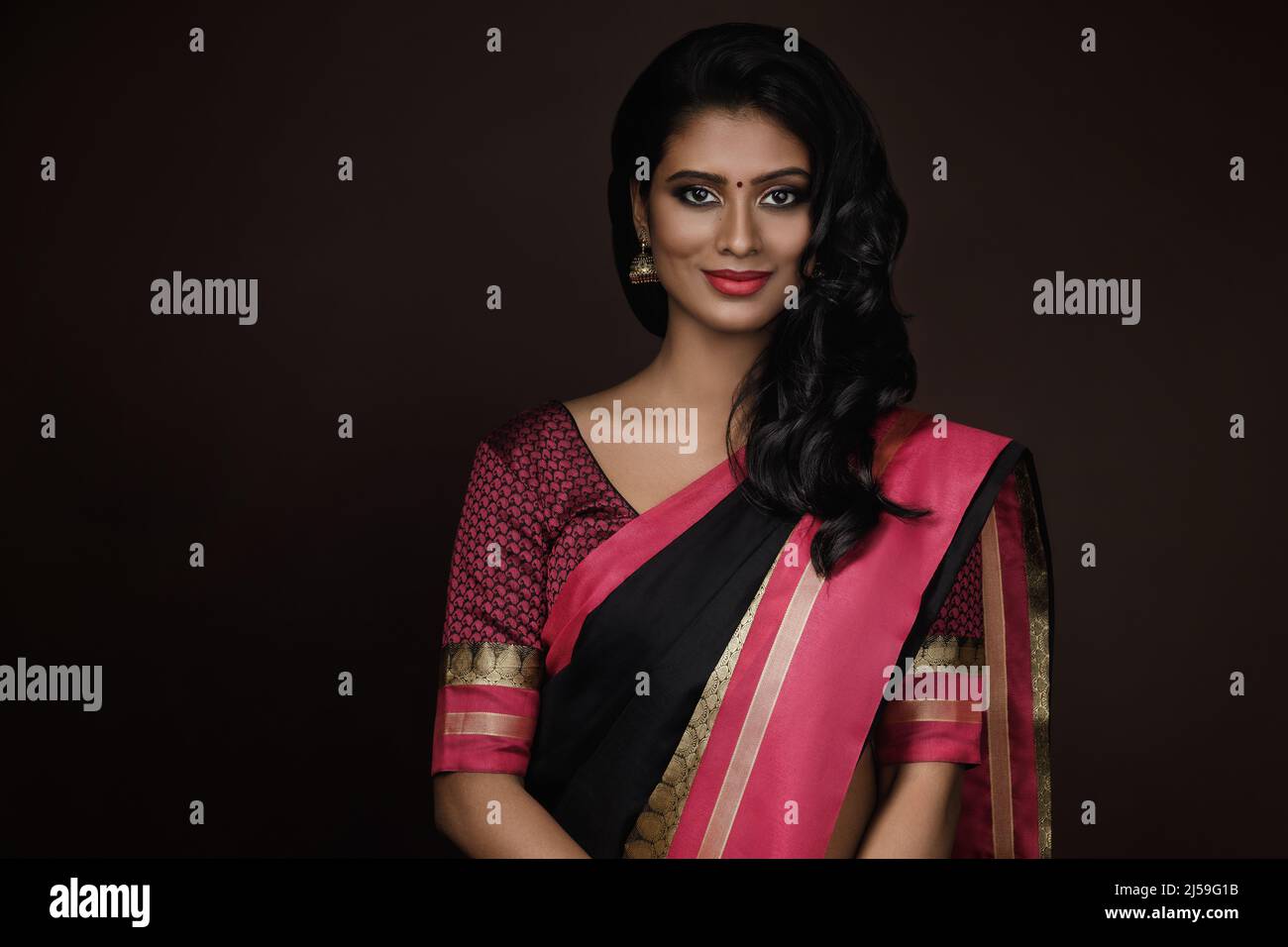 Portrait of beautiful Indian woman wearing traditional sari dress Stock ...