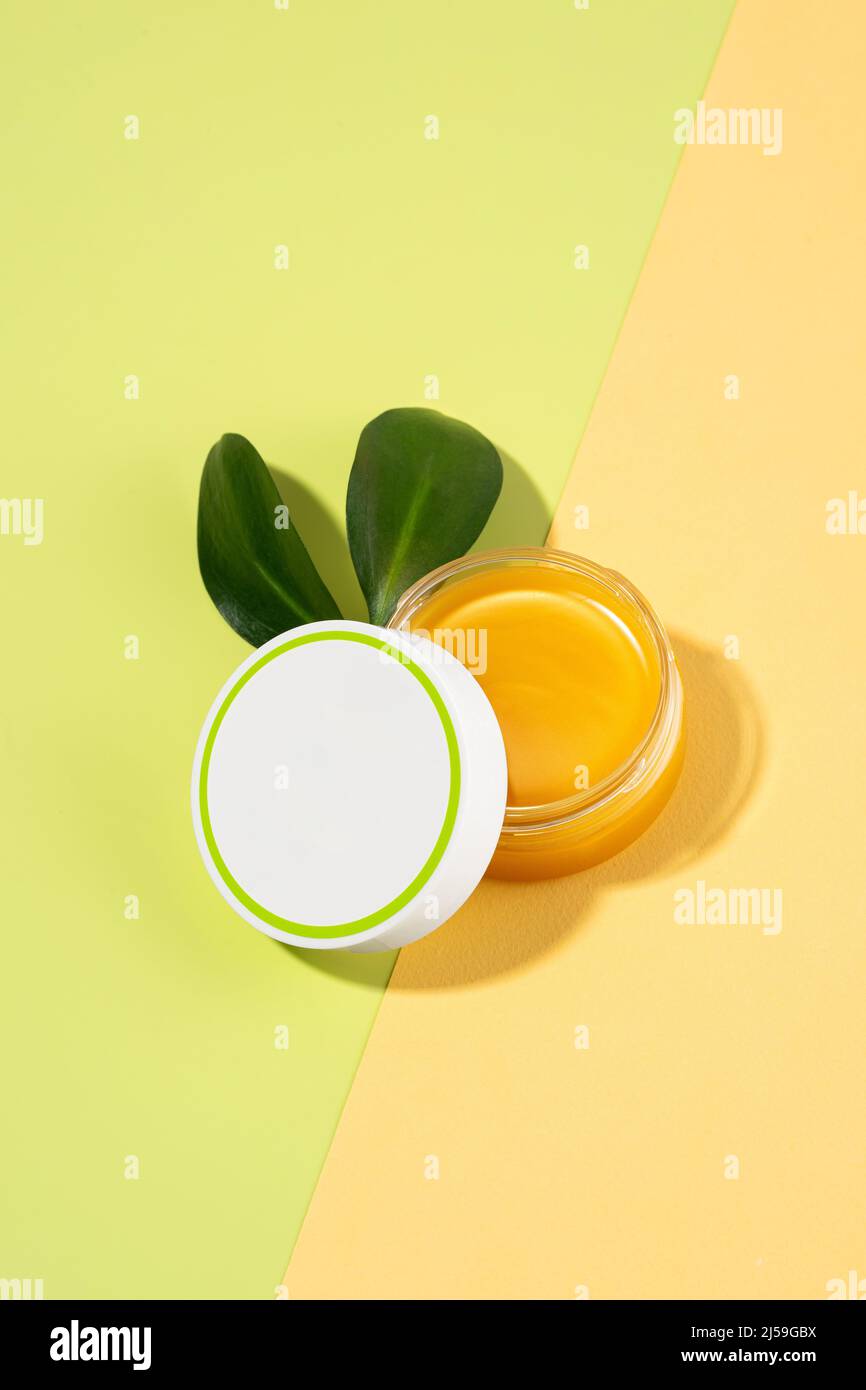 An open tin of foot balm with sheep's wool grease. Lanolin cosmetics for selfcare, a jar of