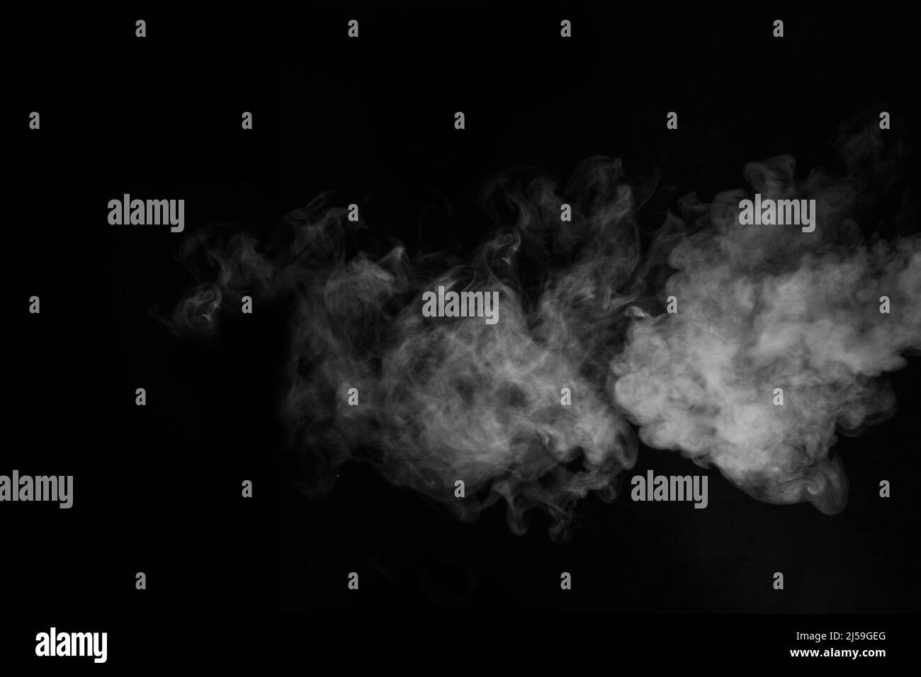 White horizontal steam, smoke isolated on black background. a