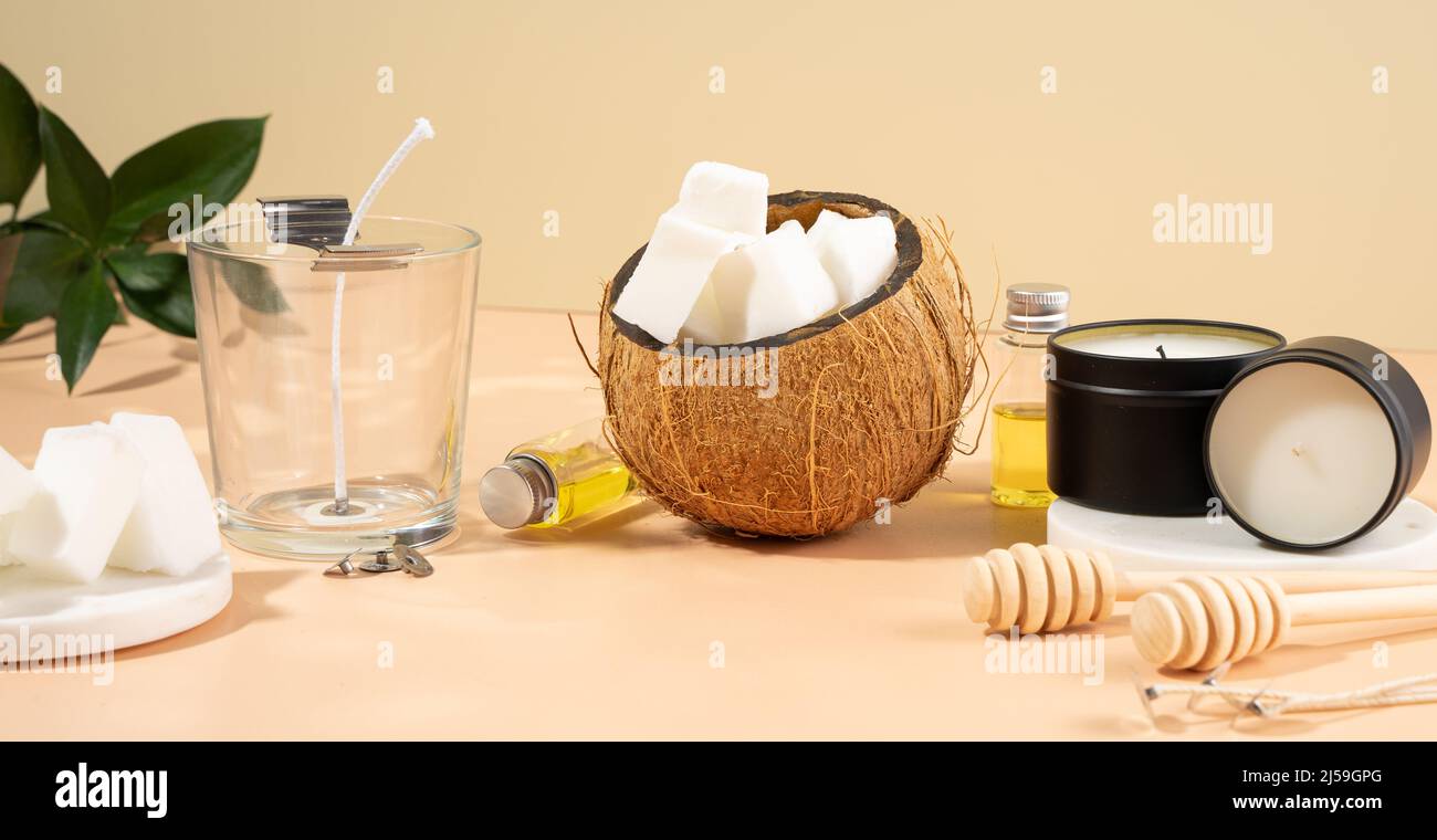 Set for homemade natural eco-friendly coconut wax candles, wick, perfume, aroma oil. Candle making utensils.Trendy diy candles to health Stock Photo