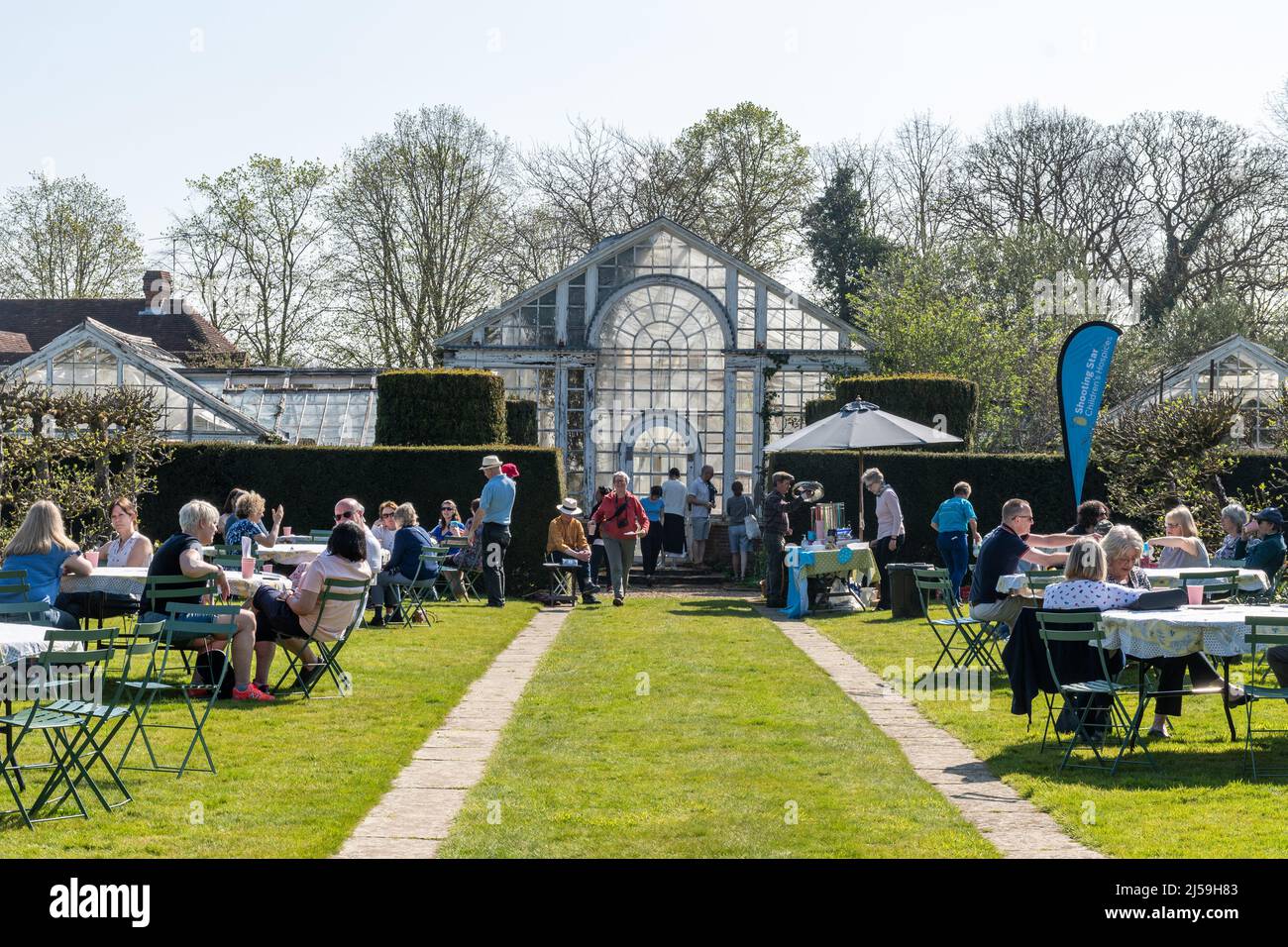 Visitors having tea and refreshments at Dunsborough Park spring tulip festival in Surrey, England, UK, during April Stock Photo