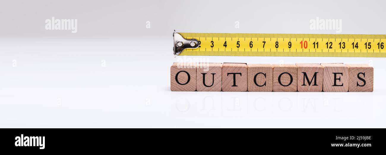 Measurement Of Word On Wooden Blocks Using Measuring Tape