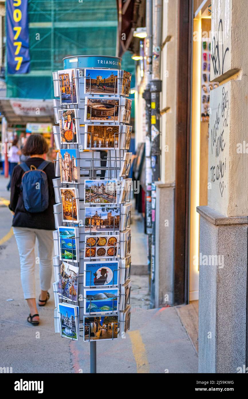 A postcard exhibit is seen in the sidewalk where people or tourists are walking. This centric district in the old town is a famous place and a major t Stock Photo