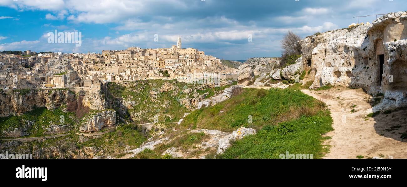 Matera - The cityscape panorama with the old cave chapels and the walley. Stock Photo