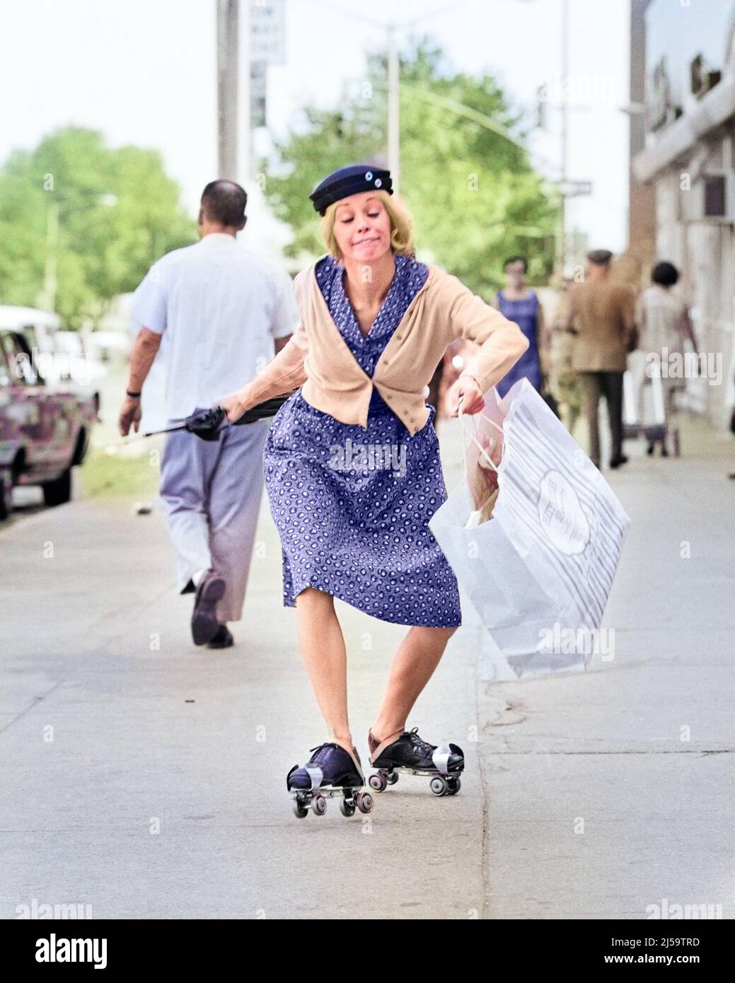 1960s 1970s WOMAN CHARACTER SHOPPING BAG LADY WITH A FUNNY FACIAL EXPRESSION WEARING ROLLER SKATES SKATING ON CITY SIDEWALK - c11338c HAR001 HARS COPY SPACE FULL-LENGTH LADIES PERSONS CHARACTER TRANSPORTATION FREEDOM HUMOROUS HAPPINESS WEIRD CHEERFUL PROGRESS ZANY COMICAL UNCONVENTIONAL FOOLISH SIMPLE SMILES ABNORMAL COMEDY GOOFY INSANITY JOYFUL STYLISH IDIOSYNCRATIC AMUSING BAG LADY BEHAVIOR CRAZINESS ECCENTRIC MID-ADULT MID-ADULT WOMAN OR MADNESS UNIQUE CAUCASIAN ETHNICITY CRAZY ERRATIC HAR001 OBLIVIOUS OLD FASHIONED OUTRAGEOUS Stock Photo