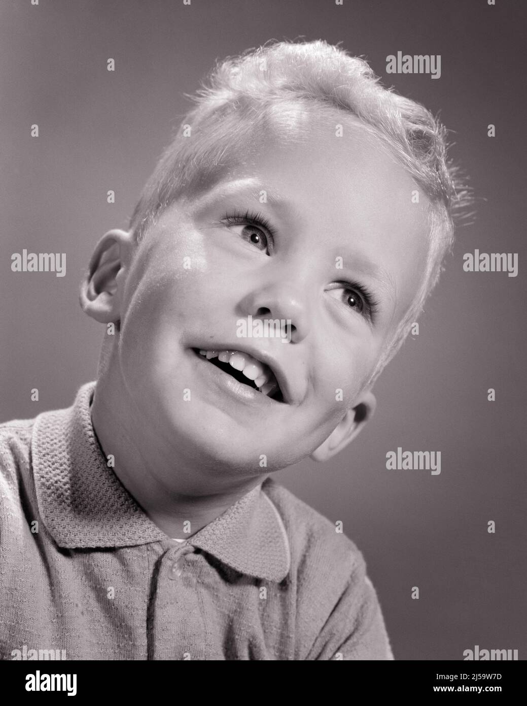 1960s SWEET PORTRAIT OF HAPPY ALERT BLONDE BOY LOOKING UP SMILING HEAD TILTED TO ONE SIDE - j11209 HAR001 HARS HOME LIFE PHYSICAL FITNESS INSPIRATION MALES CONFIDENCE EXPRESSIONS B&W HAPPINESS WELLNESS HEAD AND SHOULDERS CHEERFUL STRENGTH VICTORY COURAGE EXCITEMENT KNOWLEDGE LOW ANGLE DIRECTION PRIDE OPPORTUNITY UP SMILES CONNECTION CONCEPTUAL ALERT CURIOUS JOYFUL STYLISH TILTED PLEASANT AGREEABLE CHARMING CREATIVITY GROWTH JUVENILES LOVABLE PLEASING QUESTIONING ADORABLE APPEALING BLACK AND WHITE CAUCASIAN ETHNICITY HAR001 OLD FASHIONED Stock Photo