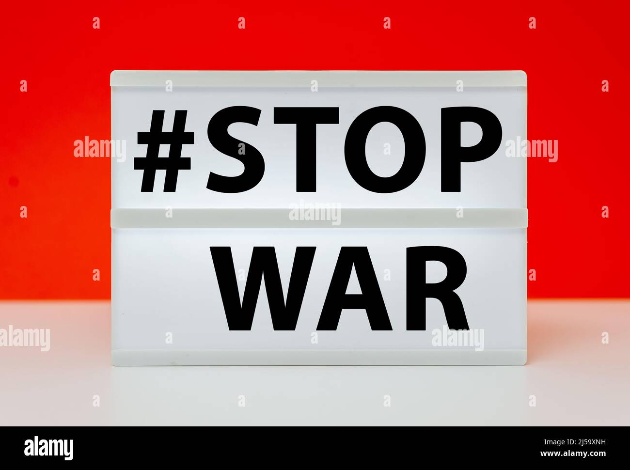 stop war text on white box with red background Stock Photo