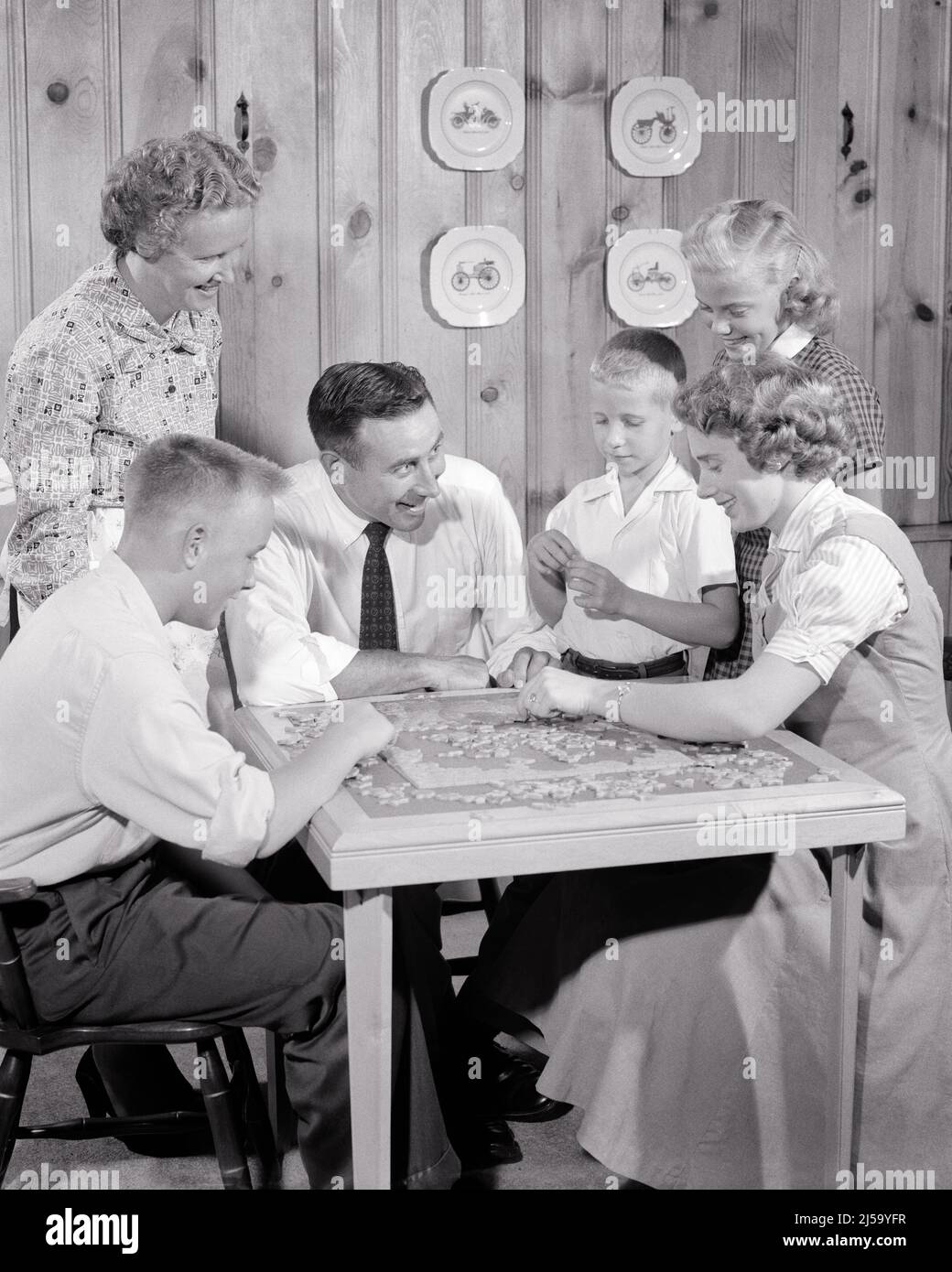 Teenagers making fun of old woman hires stock photography and images