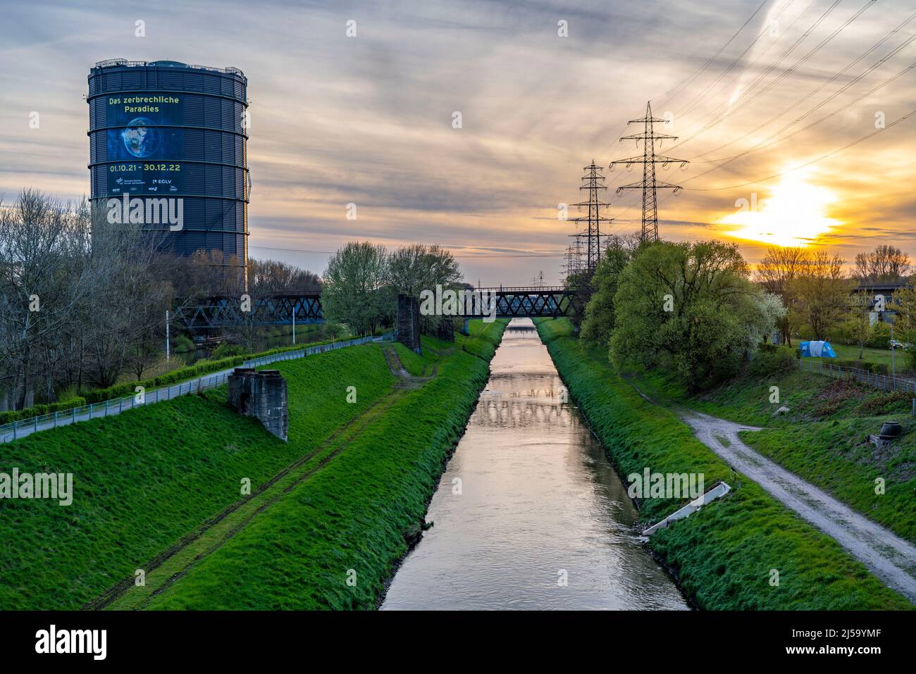 Neue Mitte Oberhausen, Gasometer exhibition hall, after renovation, Emscher River canal, evening lighting, exhibition The Fragile Paradise, NRW, Germa Stock Photo