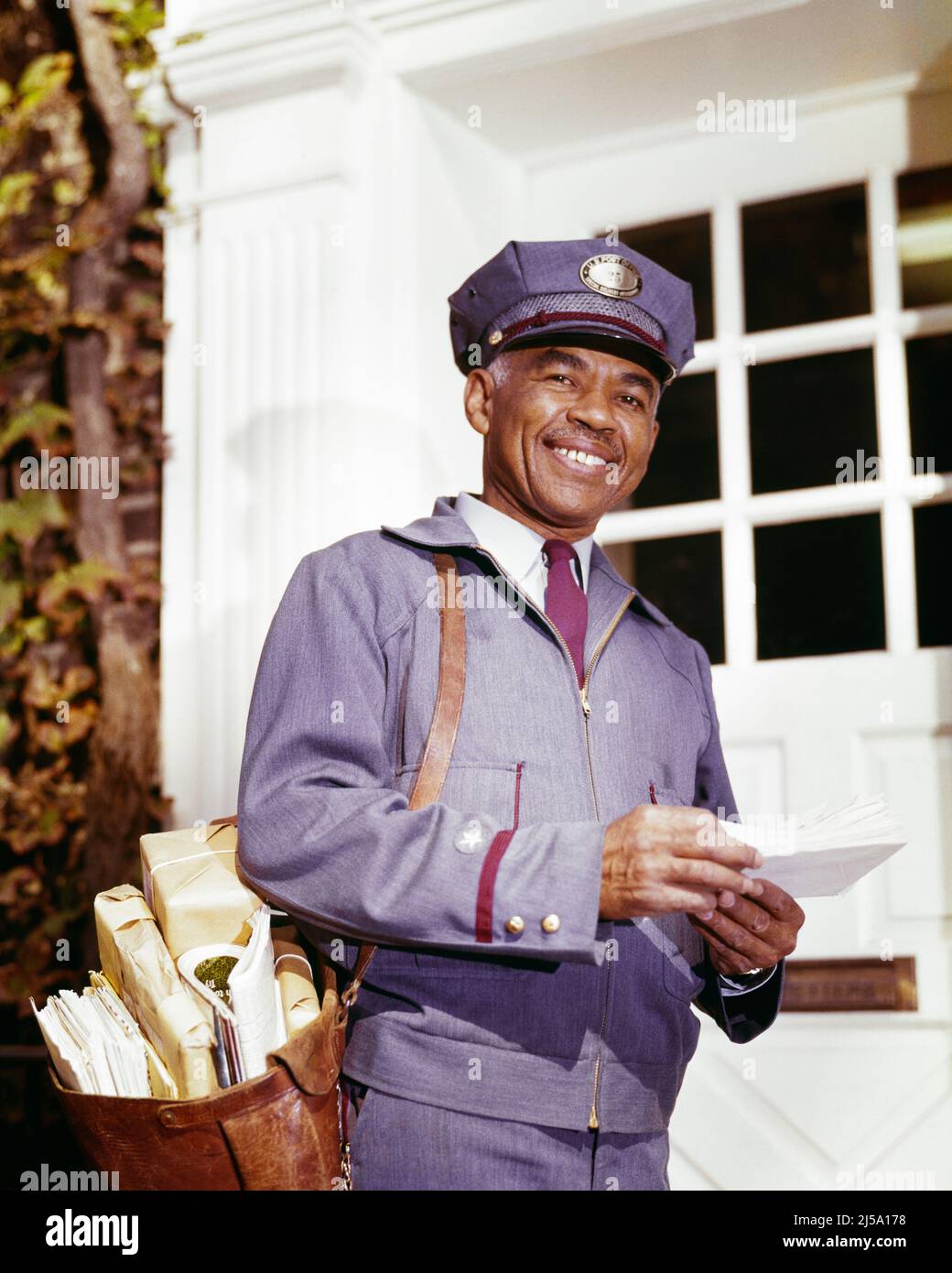 Postman delivering to old person hi-res stock photography and ...