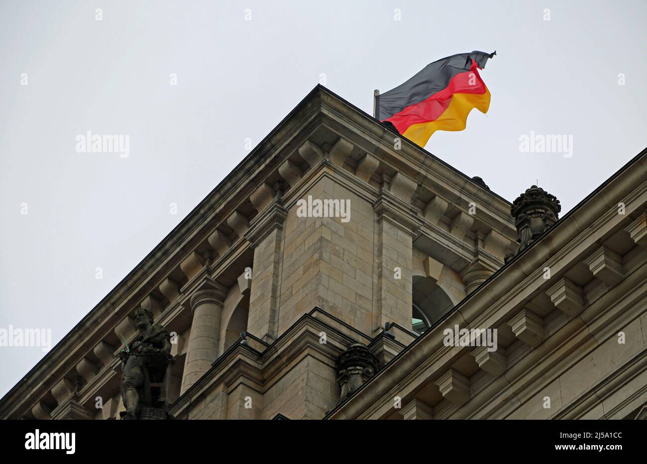 Part of the Reichstag with German flag - Berlin, Germany Stock Photo