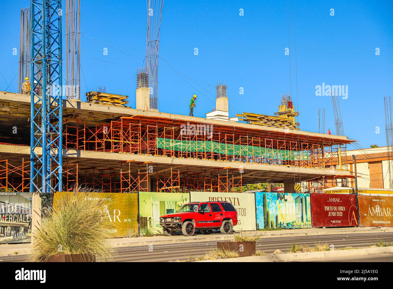 Crane and building under construction, condominiums, apartments, real