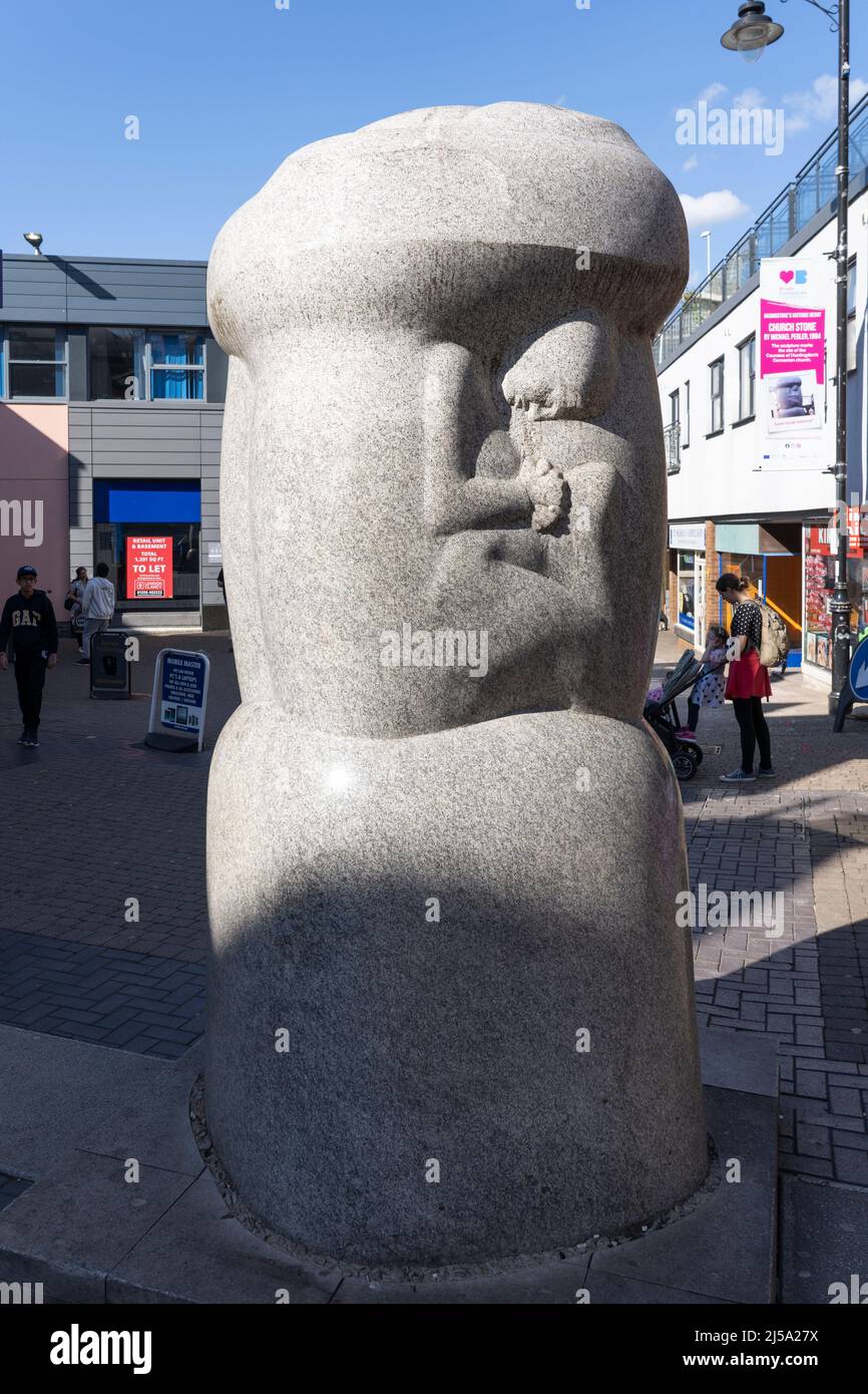 Church Stone, a granite sculpture known locally as the Wote Street Willy. Commemorates Emmanuel Church with a mother and child relief. Basingstoke, UK Stock Photo
