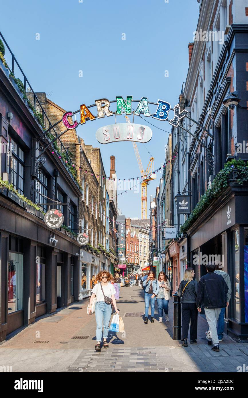 Shoppers and tourists in Foubert's Place, adjacent to Carnaby Street, in the Soho area of London, UK Stock Photo