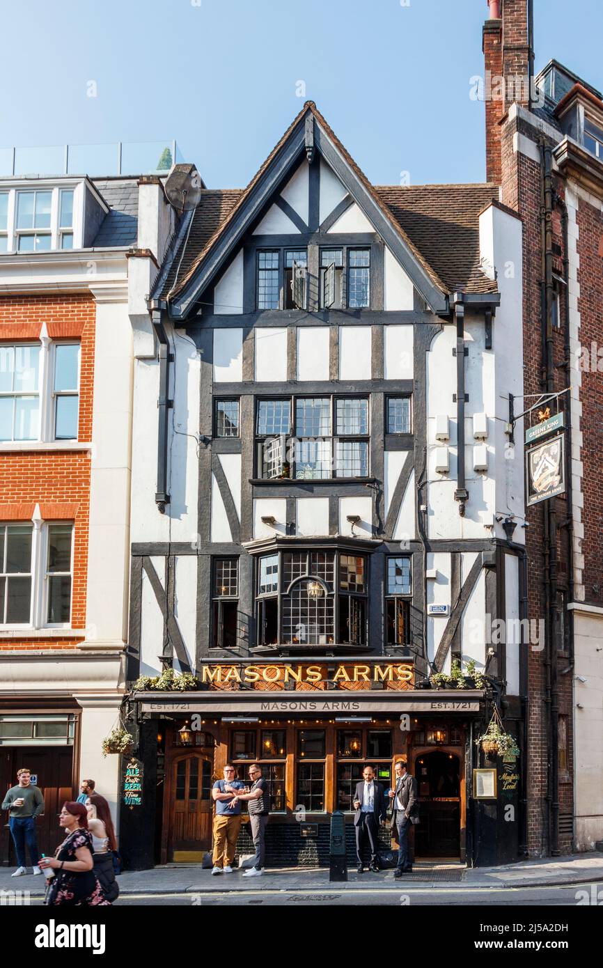 Drinkers outside the Masons Arms public house in Maddox Street, in the Mayfair area of London, UK Stock Photo