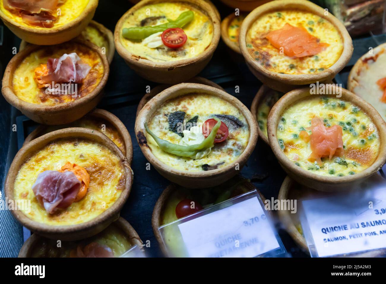 French quiches in assortment on market counter Stock Photo Alamy