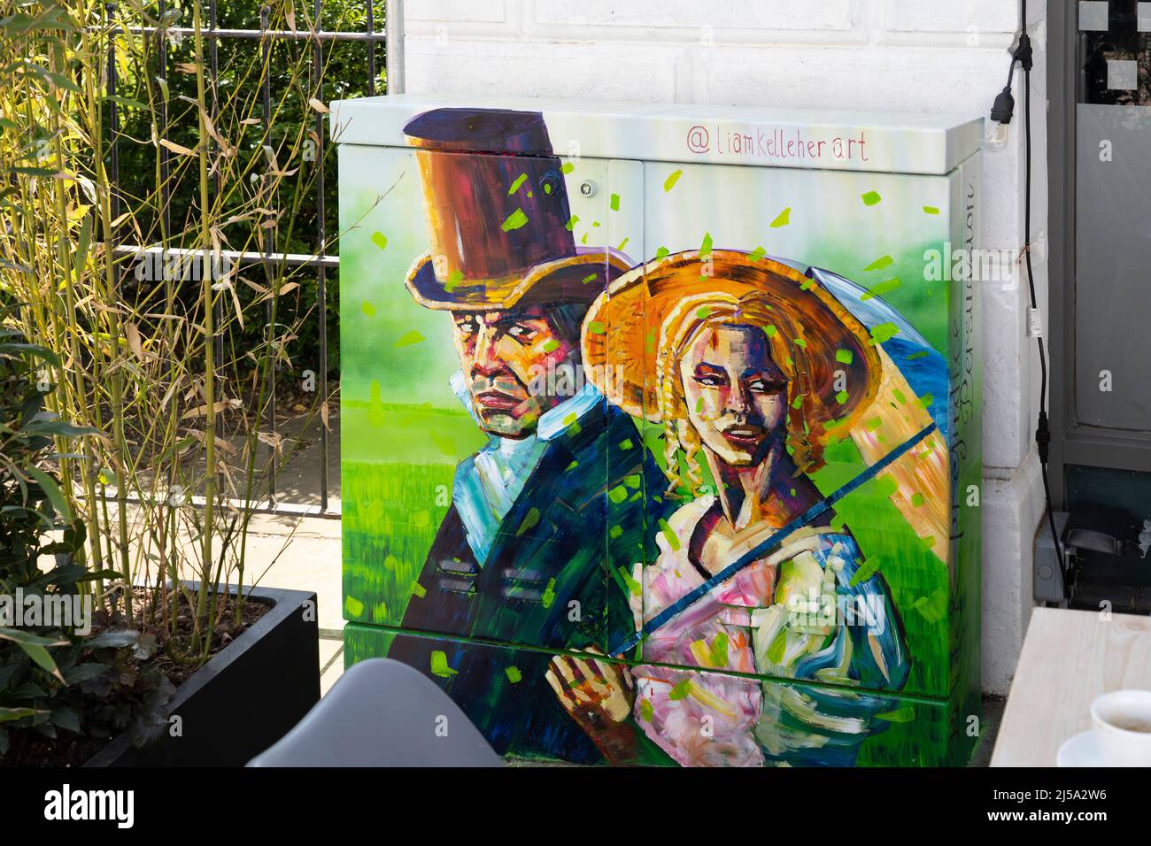 Painting of Jane Austen charachters by Liam Kelleher Art on a street cabinet on London Street in Basingstoke town centre April 2022. UK Stock Photo