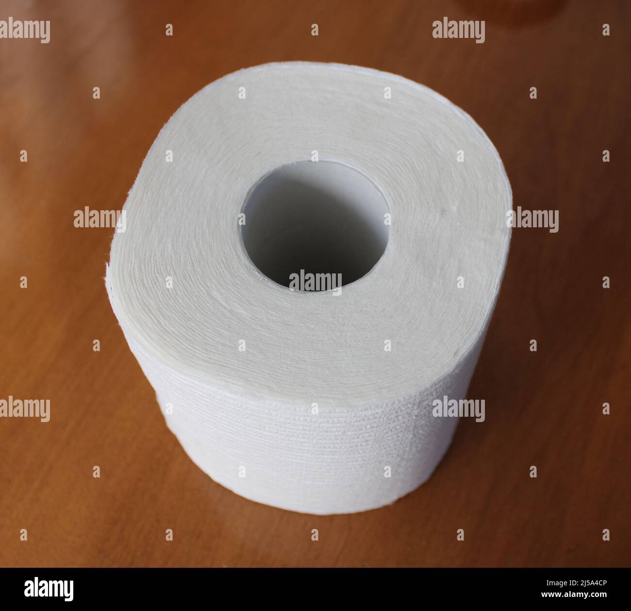 A Single Roll of Clean Toilet Paper Stock Photo Alamy