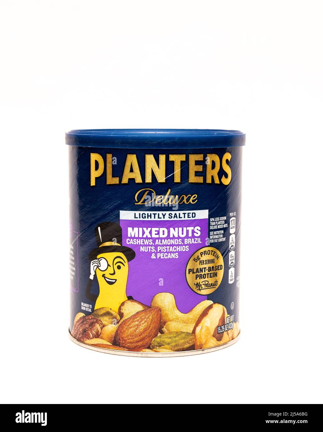 A cardboard container of Planters deluxe mixed nuts, including cashews, almonds, Brazil nuts, pecans and pistachios isolated on white Stock Photo