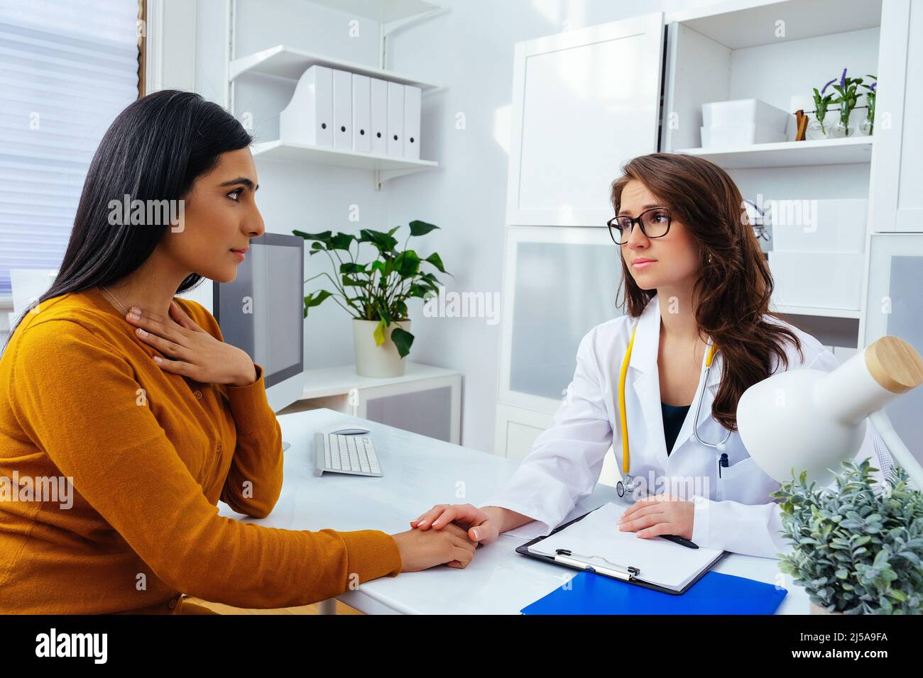 female doctor talking with her patient in hospital healthcare industry ...